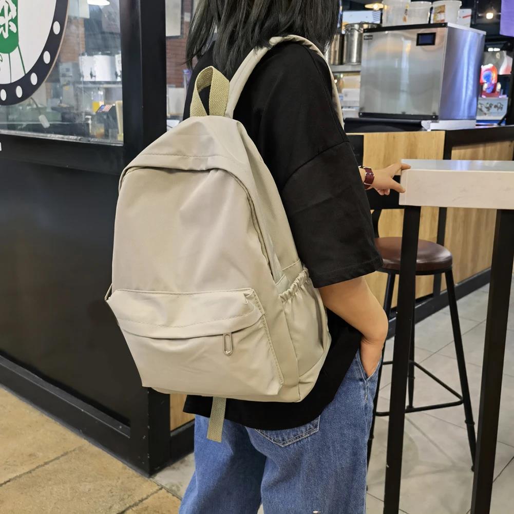 School Backpack Teen - กระเป๋าเป้สะพายหลังไนลอนสีทึบสไตล์เกาหลีสำหรับวัยรุ่นหญิง กระเป๋าสะพายไหล่แบบเบาสำหรับเล่นกีฬา ท่องเที่ยว ใช้ในชีวิตประจำวัน